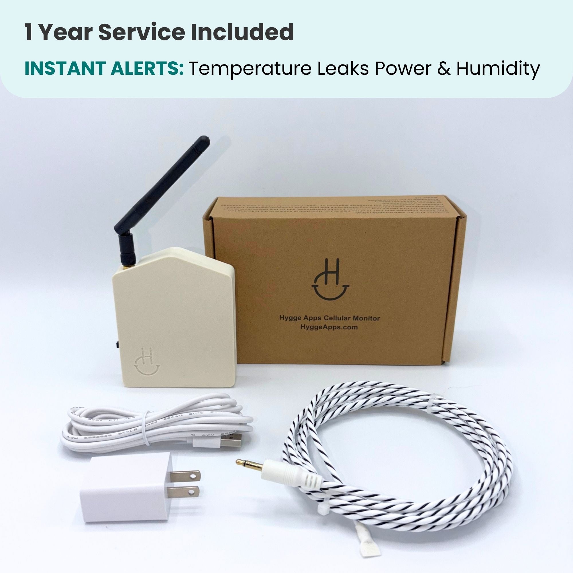 Hygge App Cellular Monitor kit with a cream-colored device, a brown cardboard box, a white USB cable, a white wall charger, and a white-and-black braided cable, displayed on a white background with a text banner at the top.